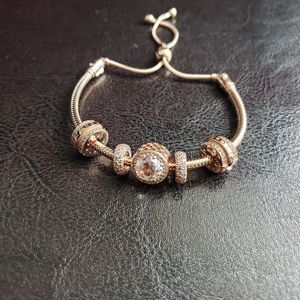 Authentic Pandora Rose Gold bracelet with charms